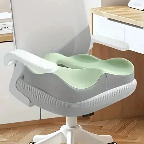 Image produit du coussin pour coccyx vert installe sur une chaise bureau