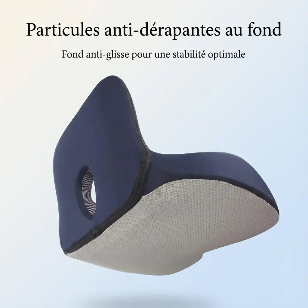 Vue du dessous du coussin ergonomique montrant les particules anti-dérapantes pour une stabilité optimale sur la chaise.